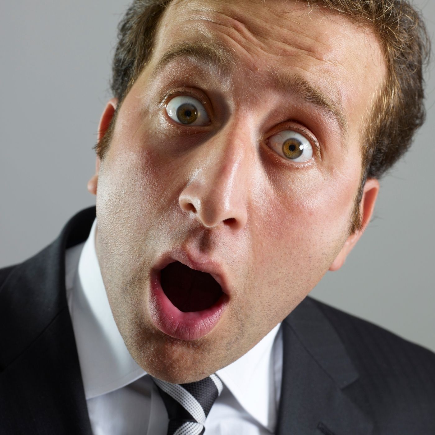 What are the most coveted status symbols among Wall Street professionals?